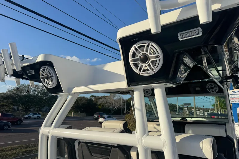 Slide: The Image of 2026 Blackfin 400 CC boat with modern design and spacious deck at a dealership. - 6