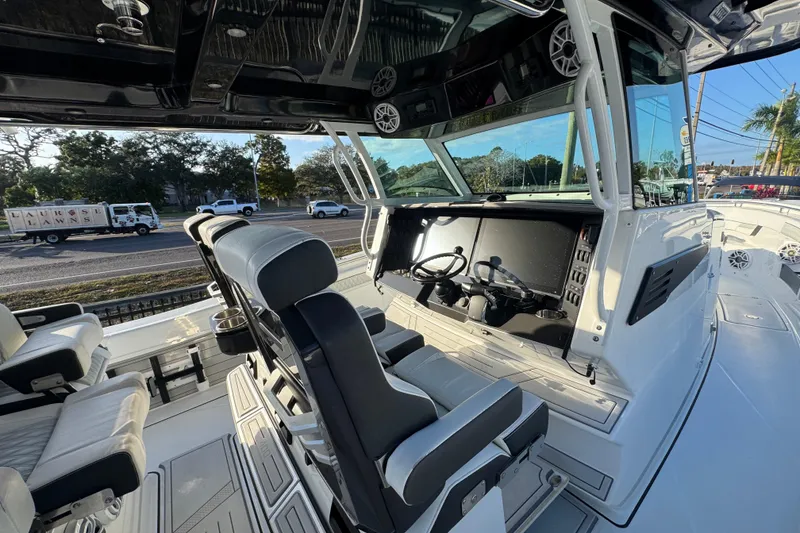 Slide: The Image of 2026 Blackfin 400 CC boat cockpit with modern controls and seating. - 9