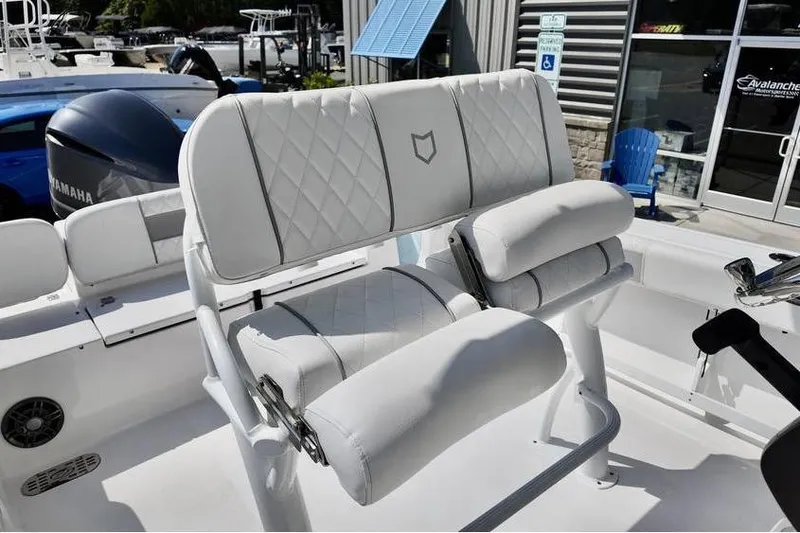 Slide: The Image of 2026 Sea Fox 248 Commander boat with white cushioned seating and Yamaha engine. - 10
