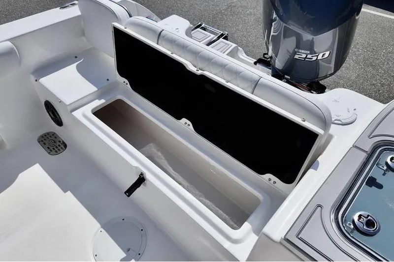 Slide: The Image of 2026 Sea Fox 248 Commander boat interior with storage compartment and Yamaha 250 engine. - 12
