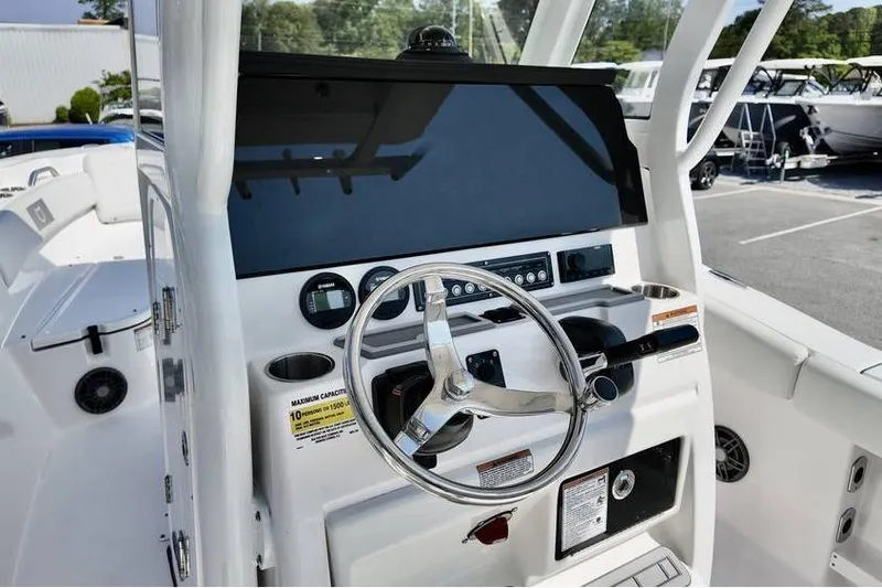 Slide: The Image of 2026 Sea Fox 248 Commander boat dashboard with steering wheel and controls. - 15