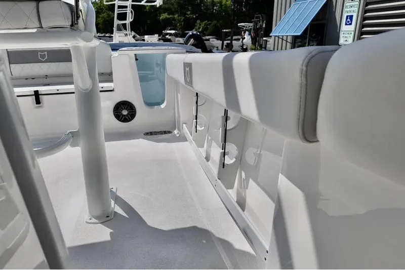 Slide: The Image of 2026 Sea Fox 248 Commander boat interior with seating and rod holders. - 16