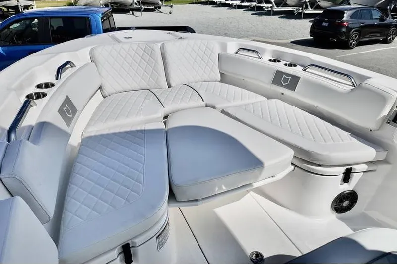 Slide: The Image of 2026 Sea Fox 248 Commander boat with luxurious white seating and cup holders. - 19