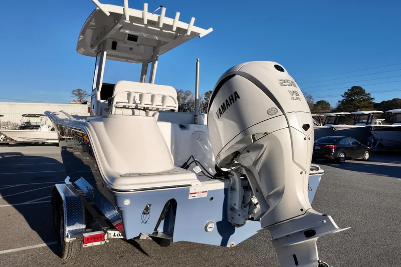 Slide: The Image of 2026 Sea Fox 248 Commander boat with Yamaha V6 engine in a parking lot. - 3