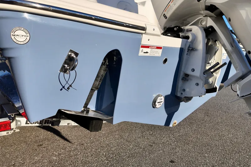 Slide: The Image of 2026 Sea Fox 248 Commander boat stern with motor and trim tabs. - 5