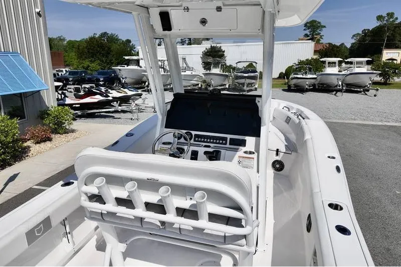 Slide: The Image of 2026 Sea Fox 248 Commander boat interior with helm, rod holders, and dashboard controls. - 6