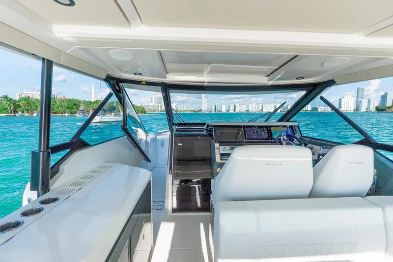 Slide: The Image of Interior view of 2025 Saxdor 400 GTO yacht with modern cockpit and ocean backdrop. - 5