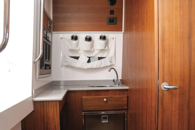 Slide: The Image of Manufacturer Provided Image: Interior of Southport 38 FE 2026 with wood paneling. - 8