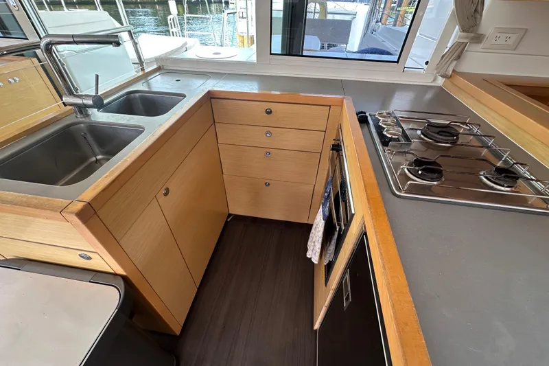 Slide: The Image of Modern kitchen in 2014 Lagoon 450 F yacht with dual sinks and gas stove. - 1