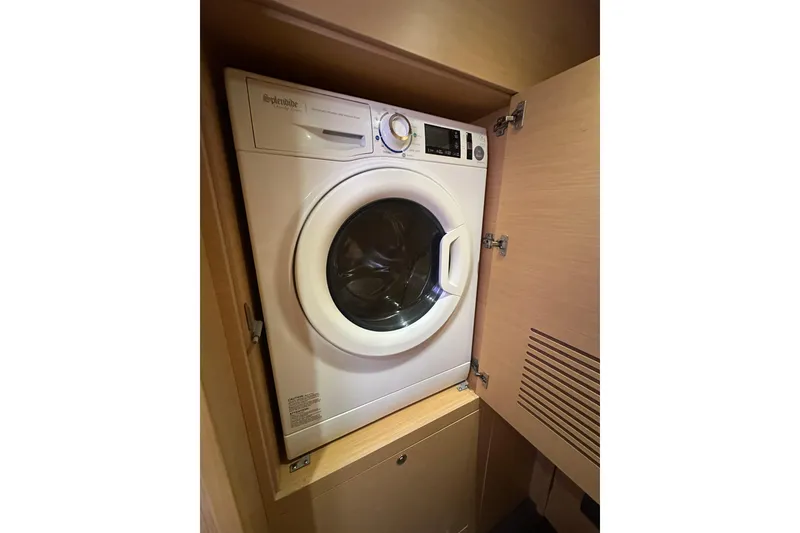 Slide: The Image of Washing machine inside a 2014 Lagoon 450 F yacht's wooden cabinet. - 14