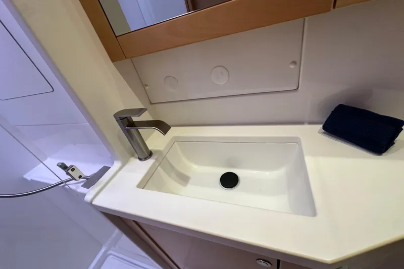 Slide: The Image of Modern bathroom sink on 2014 Lagoon 450 F yacht, featuring sleek faucet and countertop. - 15