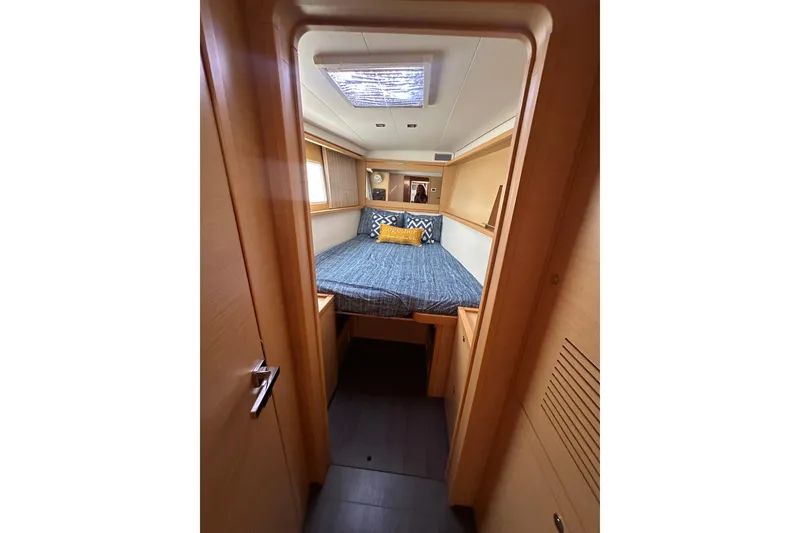 Slide: The Image of Cozy cabin interior of 2014 Lagoon 450 F catamaran with bed and skylight. - 21