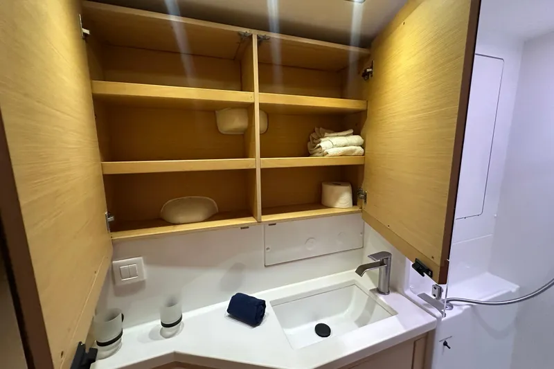 Slide: The Image of Bathroom cabinet and sink in 2014 Lagoon 450 F yacht interior. - 22