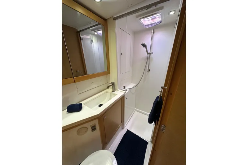 Slide: The Image of Bathroom interior of 2014 Lagoon 450 F yacht, featuring shower and sink. - 27