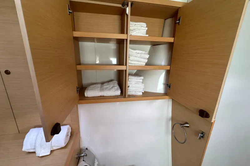 Slide: The Image of Cabinet with towels in 2014 Lagoon 450 F yacht bathroom. - 34