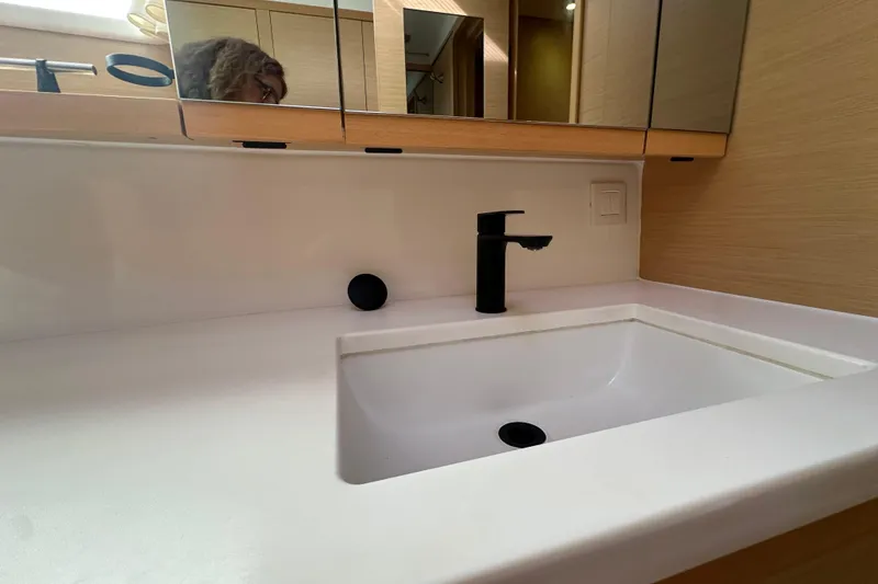 Slide: The Image of Modern bathroom sink with black faucet in 2014 Lagoon 450 F yacht. - 36