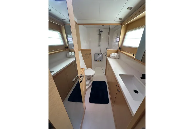Slide: The Image of Luxurious bathroom in 2014 Lagoon 450 F yacht with modern fixtures and ample lighting. - 41