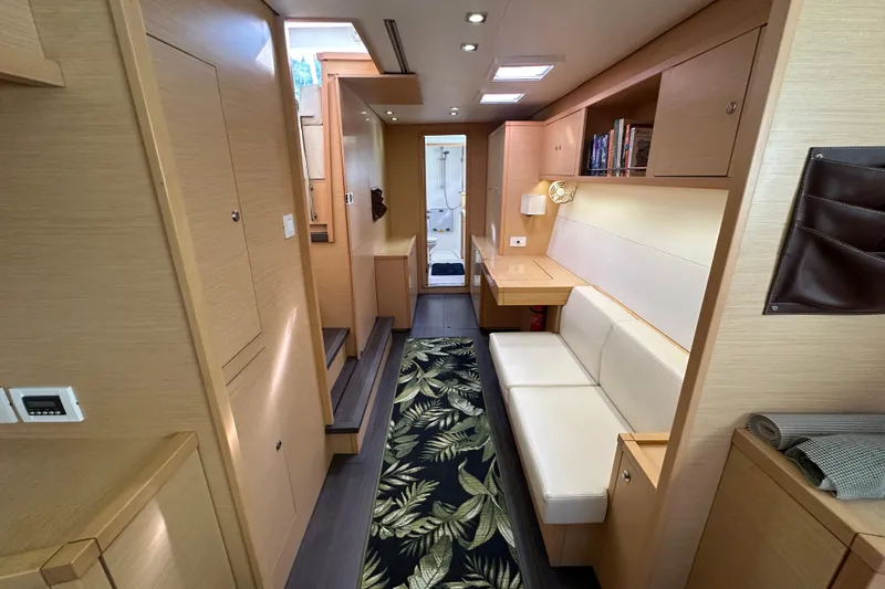 Slide: The Image of Interior of 2014 Lagoon 450 F yacht with modern furnishings and cozy seating area. - 42