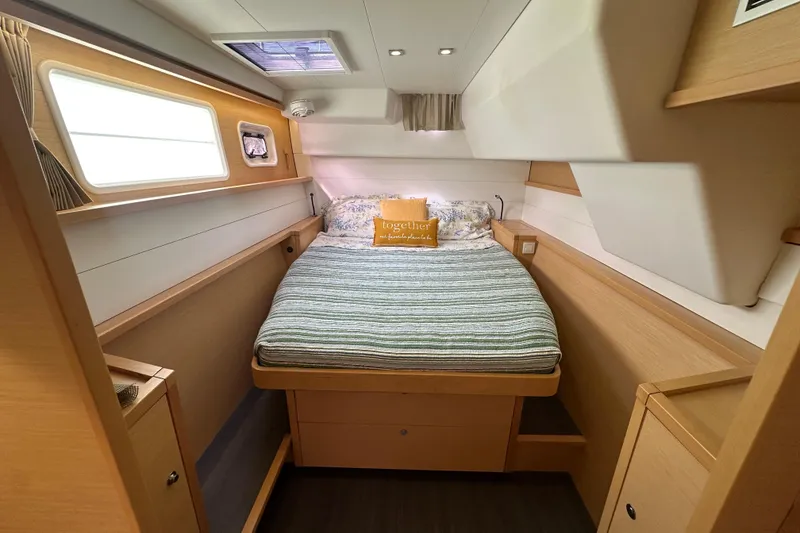 Slide: The Image of Cozy cabin interior of 2014 Lagoon 450 F catamaran with bed and wooden furnishings. - 45