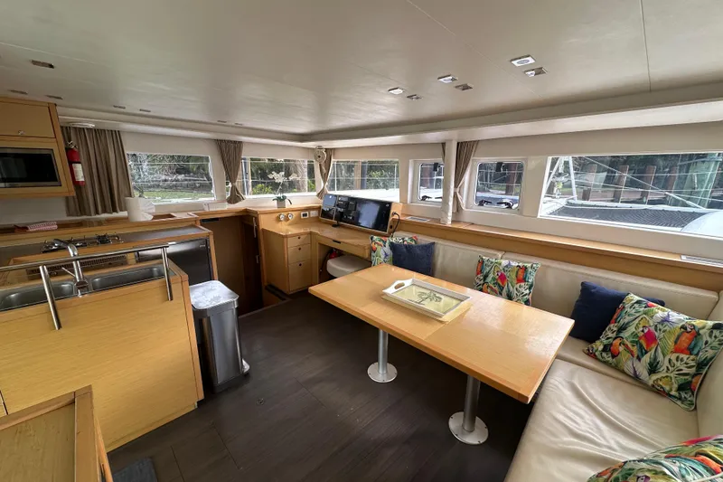 Slide: The Image of Interior of 2014 Lagoon 450 F catamaran with modern kitchen and cozy seating area. - 47