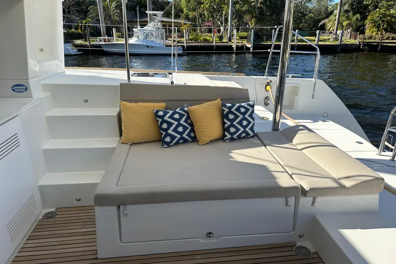 Slide: The Image of Cozy seating area on 2014 Lagoon 450 F yacht with decorative cushions. - 61
