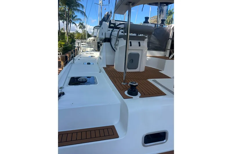 Slide: The Image of 2019 Lagoon 42 catamaran deck with teak flooring and modern design. - 18