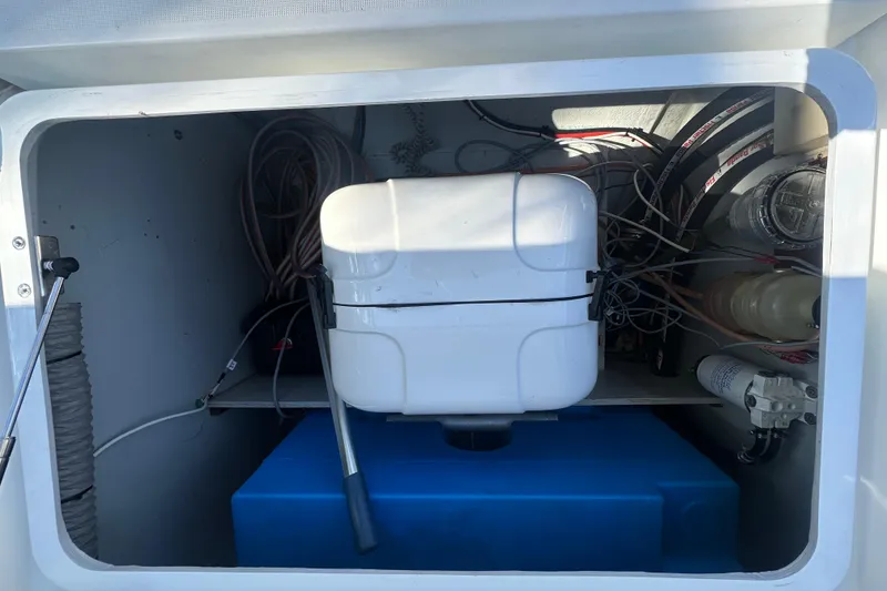 Slide: The Image of Interior view of a 2019 Lagoon 42 yacht compartment with wiring and equipment. - 28