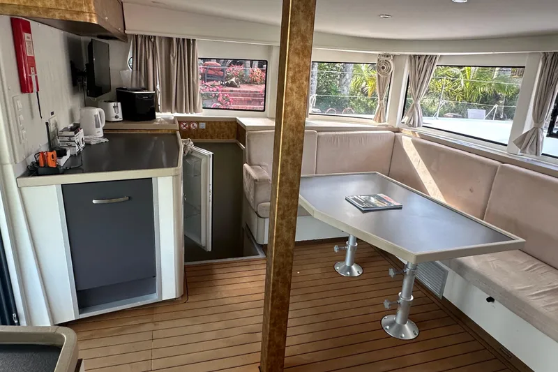 Slide: The Image of Interior of 2019 Lagoon 42 catamaran with kitchen and dining area. - 32