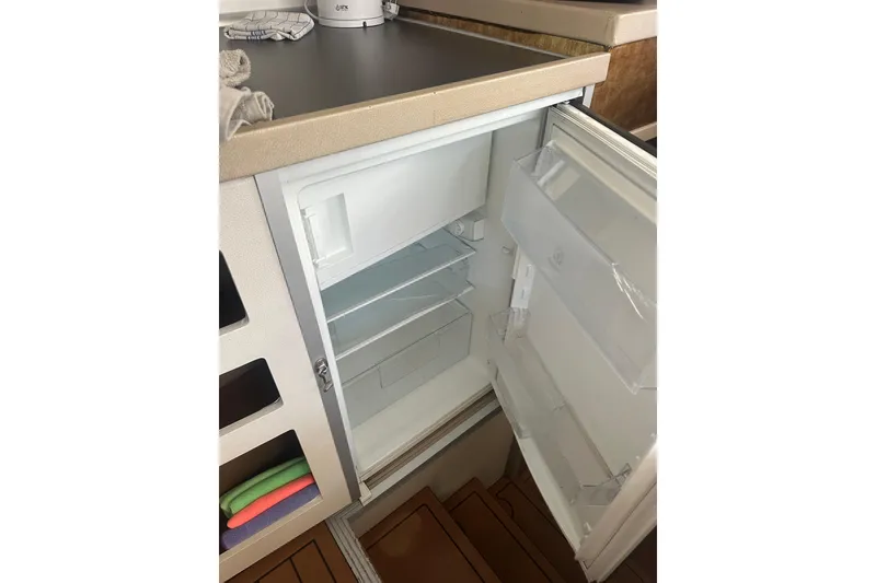 Slide: The Image of Open refrigerator in 2019 Lagoon 42 yacht kitchen interior. - 38