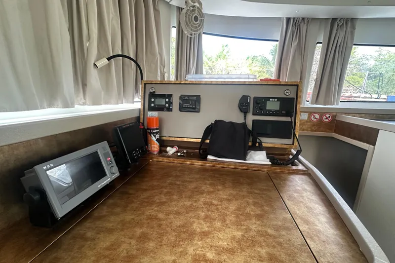 Slide: The Image of Interior of 2019 Lagoon 42 catamaran with navigation equipment and control panel. - 39