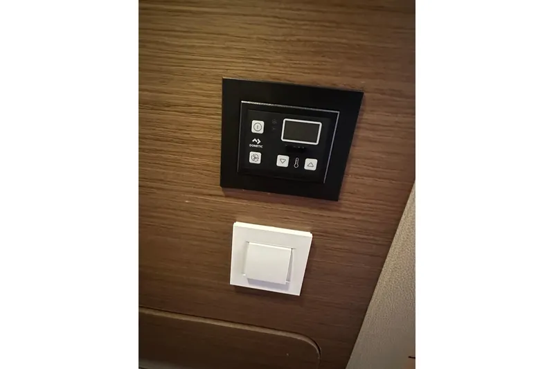 Slide: The Image of Control panel and switch on Lagoon 42 yacht, 2019 model, wooden interior. - 41