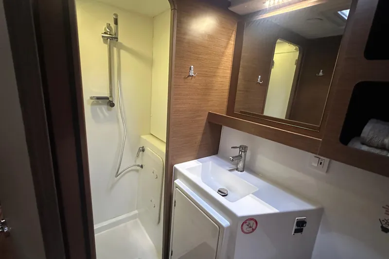Slide: The Image of Modern bathroom in 2019 Lagoon 42 yacht with shower and sink. - 47