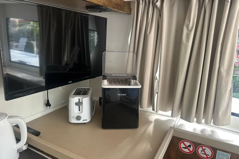 Slide: The Image of Kitchen appliances on a Lagoon 42 catamaran, including a toaster and ice maker, 2019 model. - 60