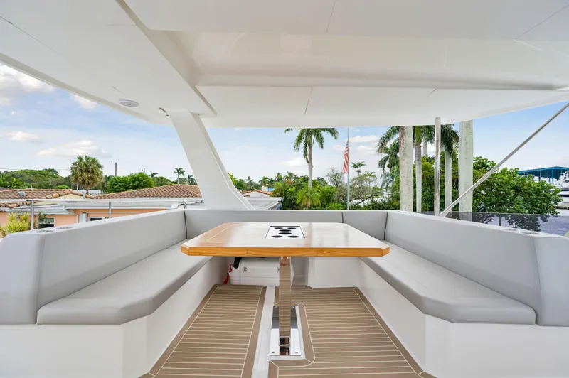 Slide: The Image of Leopard 53 Powercat 2024 yacht with spacious outdoor seating and table. - 31