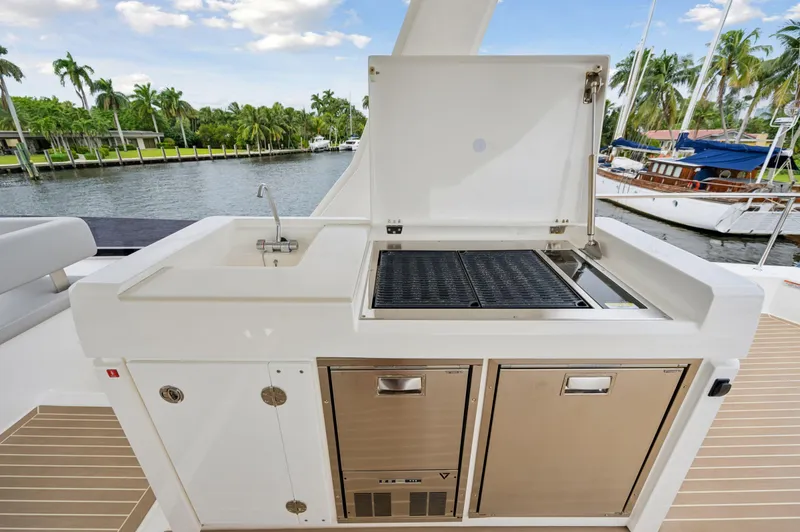 Slide: The Image of Outdoor kitchen on 2024 Leopard 53 Powercat yacht with grill and sink. - 33