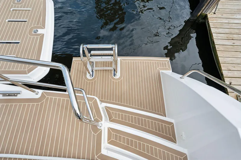 Slide: The Image of 2024 Leopard 53 Powercat swim platform with ladder and teak decking. - 38