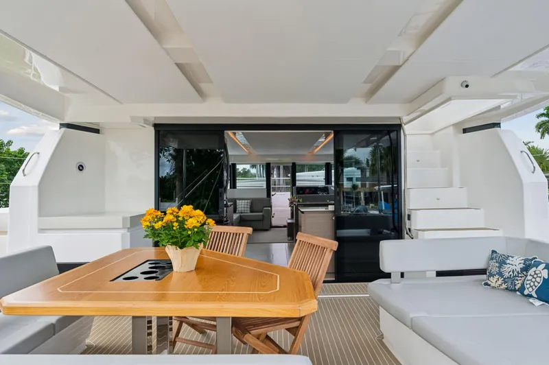 Slide: The Image of Luxurious 2024 Leopard 53 Powercat yacht interior with elegant seating and dining area. - 44