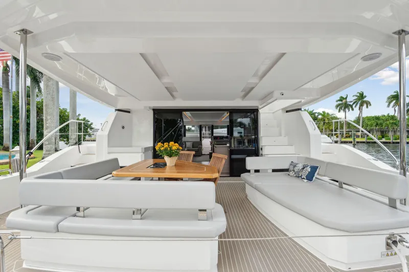 Slide: The Image of Luxurious 2024 Leopard 53 Powercat yacht interior with elegant seating and dining area. - 45