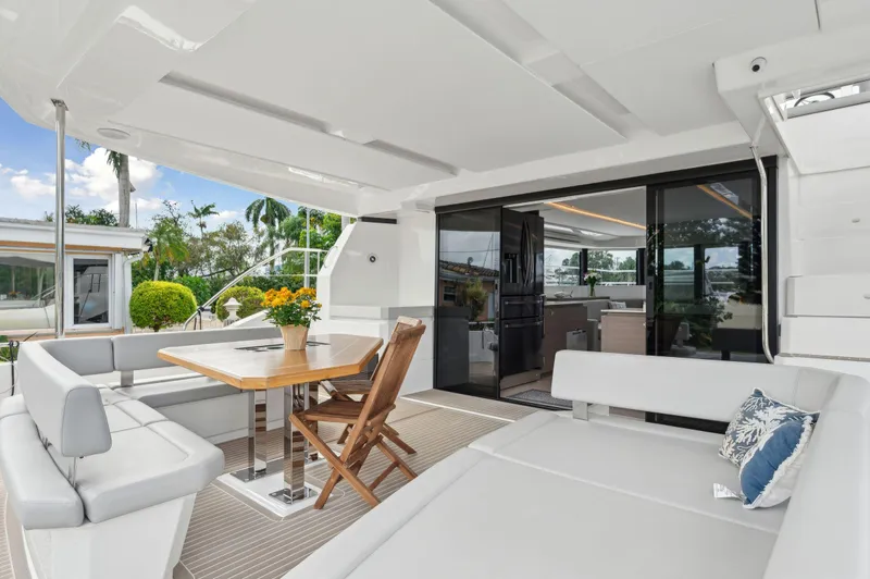 Slide: The Image of Luxurious 2024 Leopard 53 Powercat yacht interior with elegant seating and dining area. - 46