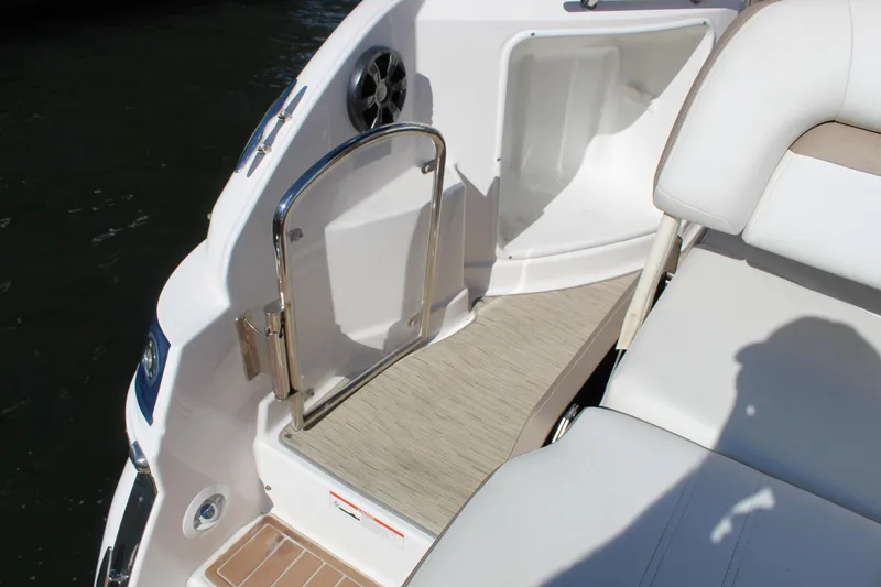 Slide: The Image of 2018 Regal 28 Express boat interior with open hatch and seating area. - 12