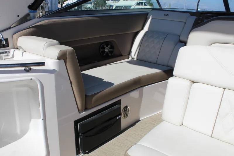 Slide: The Image of 2018 Regal 28 Express boat interior with beige seating and modern design. - 20