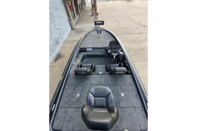 Slide: The Image of 2026 Phoenix 919 ZXL boat interior with seating and steering console. - 5