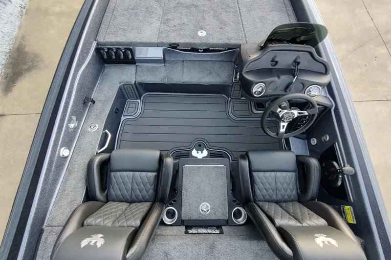 Slide: The Image of Interior of 2026 Phoenix 919 ZXL boat with dual seats and steering console. - 7