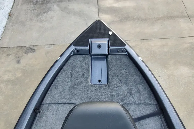 Slide: The Image of Front deck of 2026 Phoenix 919 ZXL boat with carpeted surface and control panel. - 8