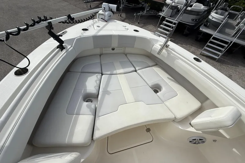 Slide: The Image of 2022 Mako 234 Center Console boat with spacious seating and modern design. - 13