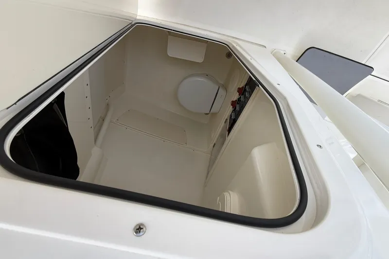 Slide: The Image of 2022 Mako 234 Center Console boat interior storage compartment. - 22