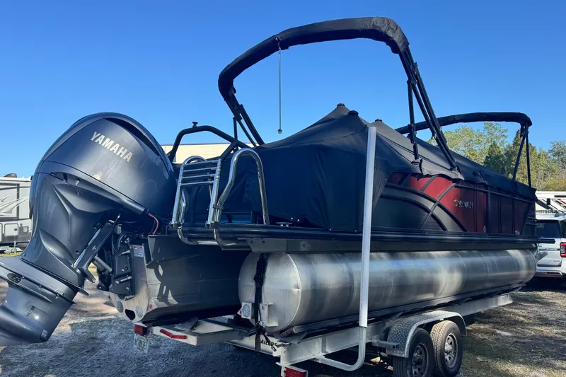 Slide: The Image of 2023 Sylvan L5 CLZ pontoon boat with Yamaha outboard motor on trailer. - 10