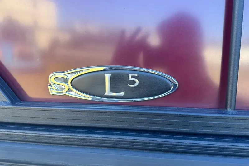 Slide: The Image of 2023 Sylvan L5 CLZ emblem on a maroon background. - 17