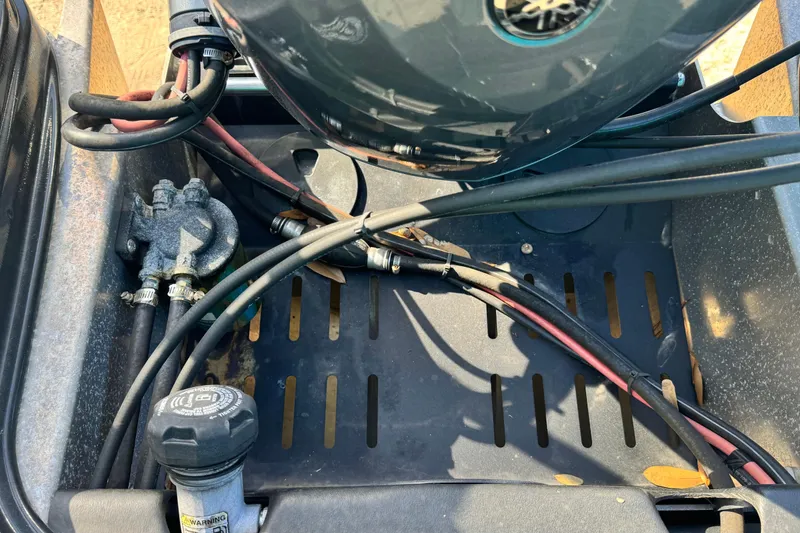 Slide: The Image of 2023 Sylvan L5 CLZ boat engine compartment with cables and components. - 22