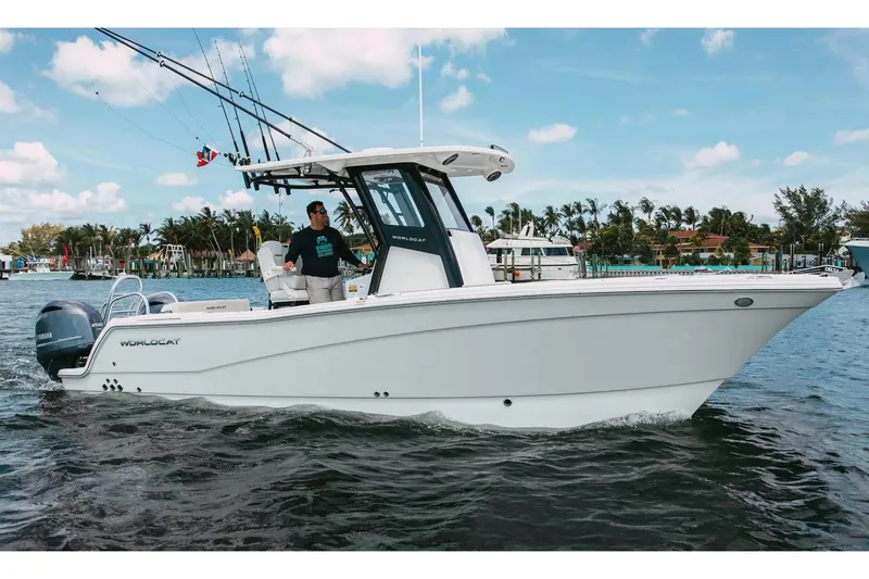 The Image of Manufacturer Provided Image: 2026 World Cat 265 CC-X boat cruising on water with fishing rods and scenic background. - 0